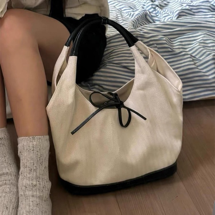 Korean version niche canvas tote for women 2024 new commuting fashion handbag versatile single armpit shoulder bag