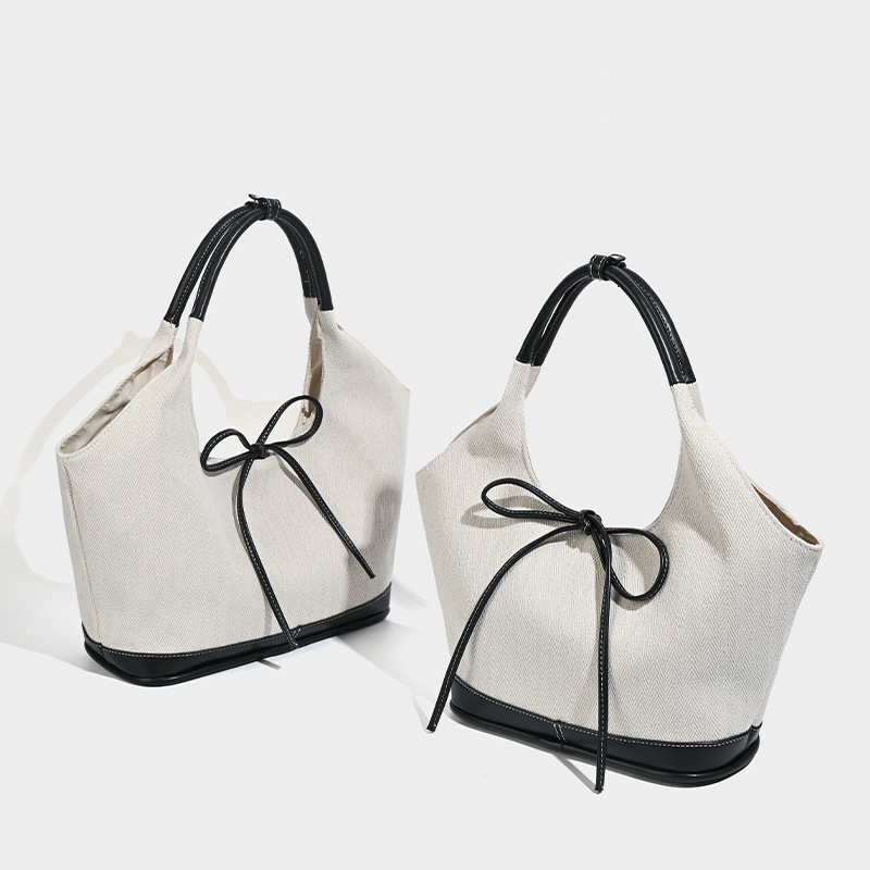 Korean version niche canvas tote for women 2024 new commuting fashion handbag versatile single armpit shoulder bag