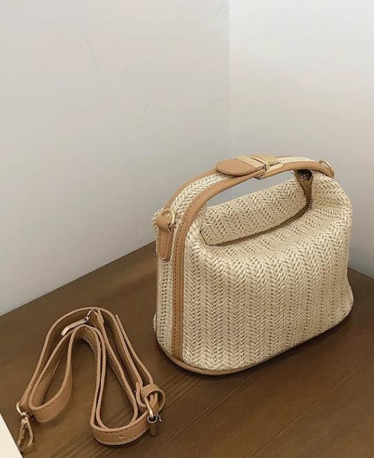 Water bucket wrapped grass woven small casual women's hand-held one shoulder crossbody bag, new for spring 2024