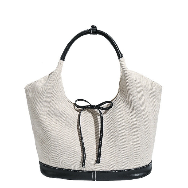 Korean version niche canvas tote for women 2024 new commuting fashion handbag versatile single armpit shoulder bag
