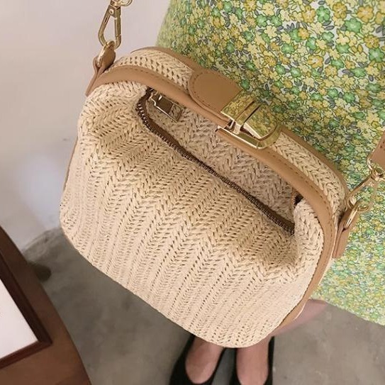 Water bucket wrapped grass woven small casual women's hand-held one shoulder crossbody bag, new for spring 2024