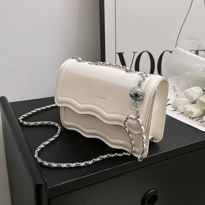 2025 New Women's Casual Shoulder Bag With Fashionable Underarm Design And Wave Chain Shoulders Paired With Simple Material Crossbody Bag And Smal