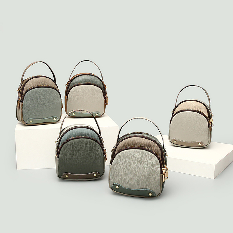 Cowhide Small Round 2025 Summer New Designer Bag Fashionable And Casual Cross Shoulder Contrasting Color Women's Handheld Broadband Bag Women