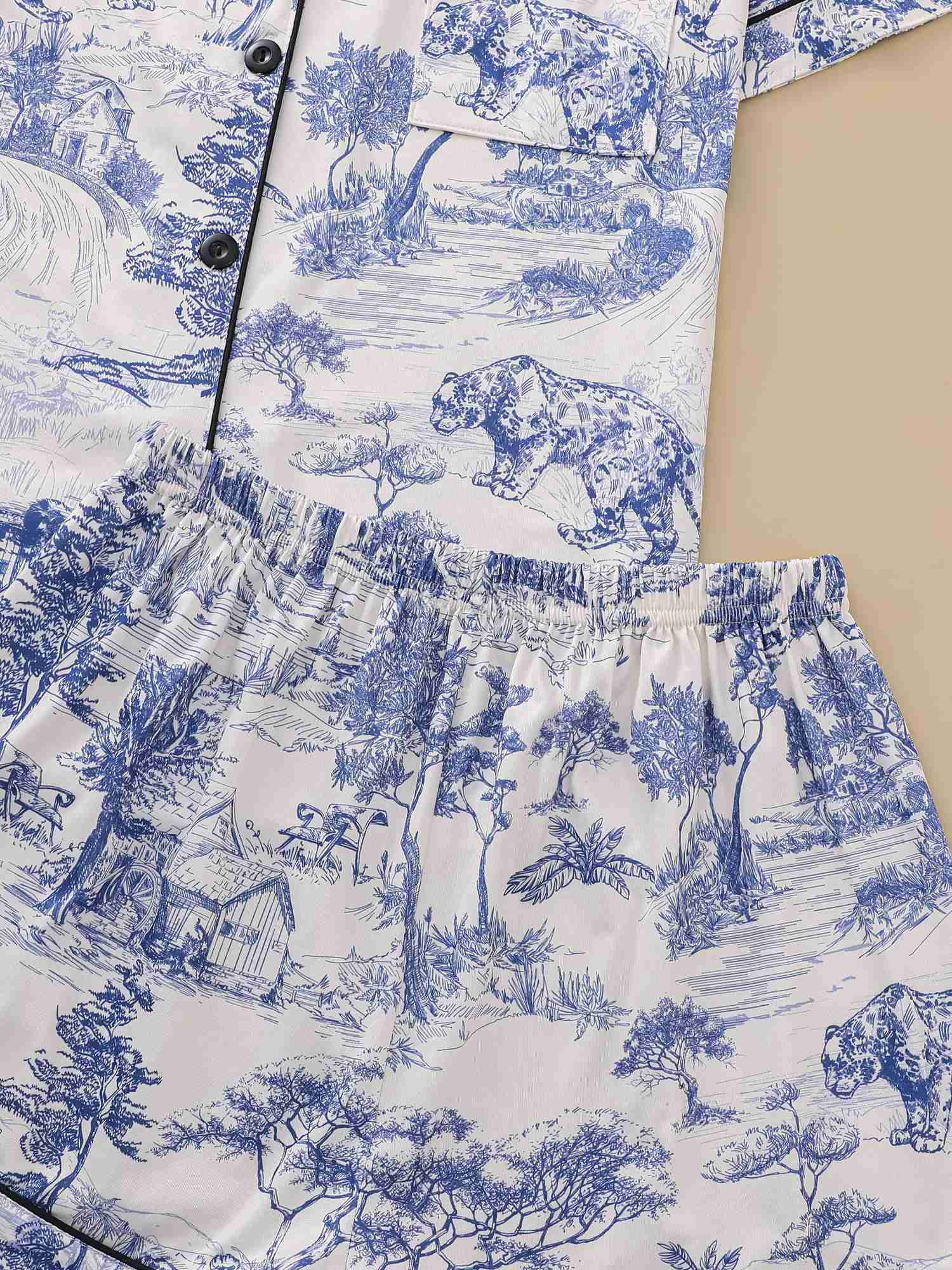 Natural animal print pajama set with comfortable short sleeved lapel top and elastic waistband shorts W240919