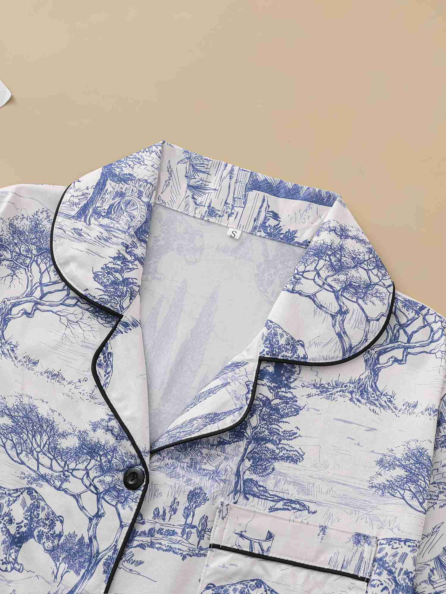 Natural animal print pajama set with comfortable short sleeved lapel top and elastic waistband shorts W240919