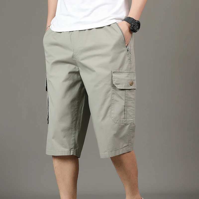 Mens Solid Color Pockets Button Elastic High Waisted Summer Casual Straight Vacation Cargo Capri Pants Preppy Style ShortsX240921