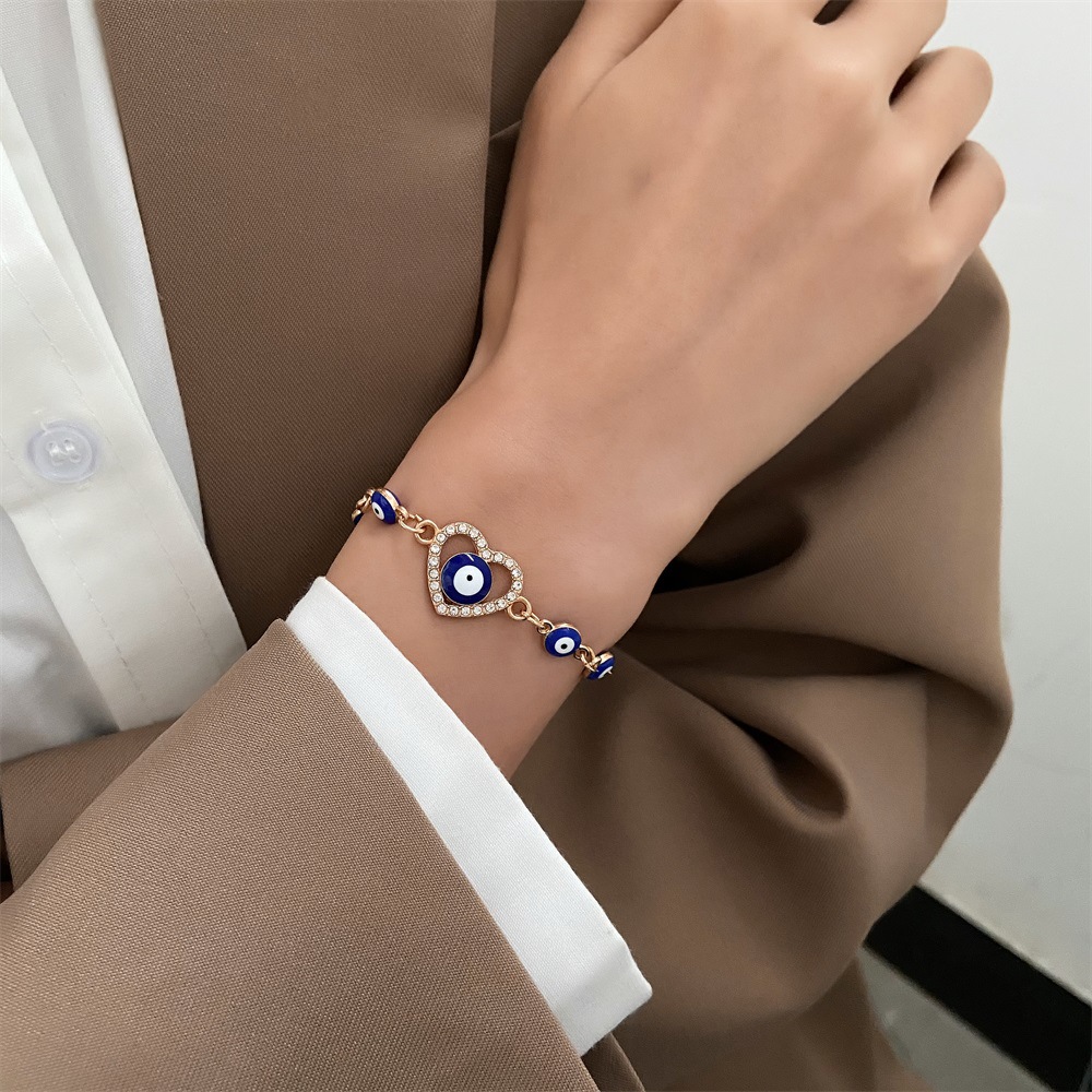 Beaded bracelet European and American Fashion Handpiece Devil's Eye Hollow Diamond Heart Drip Oil Eye Bracelet