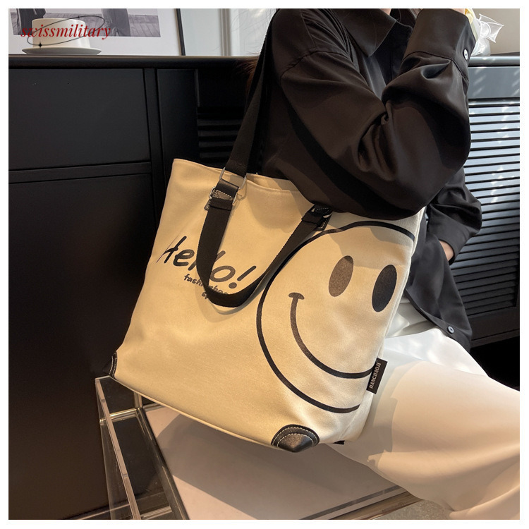 2024 new large capacity fashionable simple shoulder canvas bag Korean version casual student smig face handbag for women #27 Swissmilitary