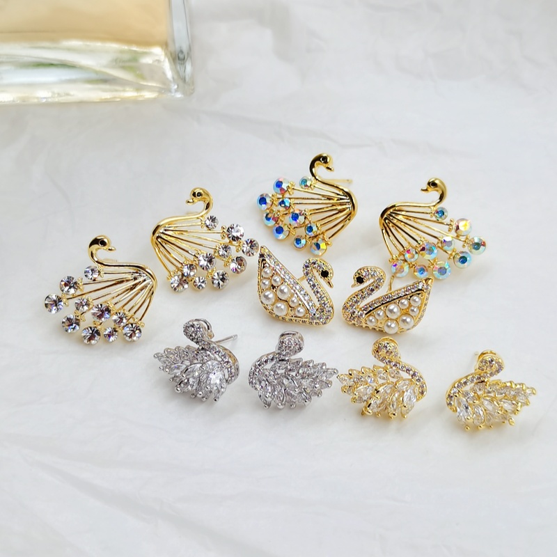 Swan shaped zirconium stud earrings with gold-plated copper body and design for high quality and luxury earrings