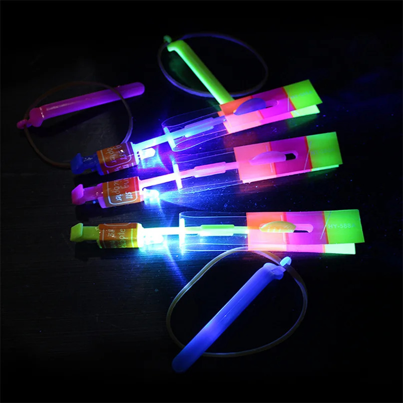 50pcs Amazing Light Toy Rocket Helicopter Flying Toy LED Light Toys Party Fun Gift Rubber Band Catapult 240105