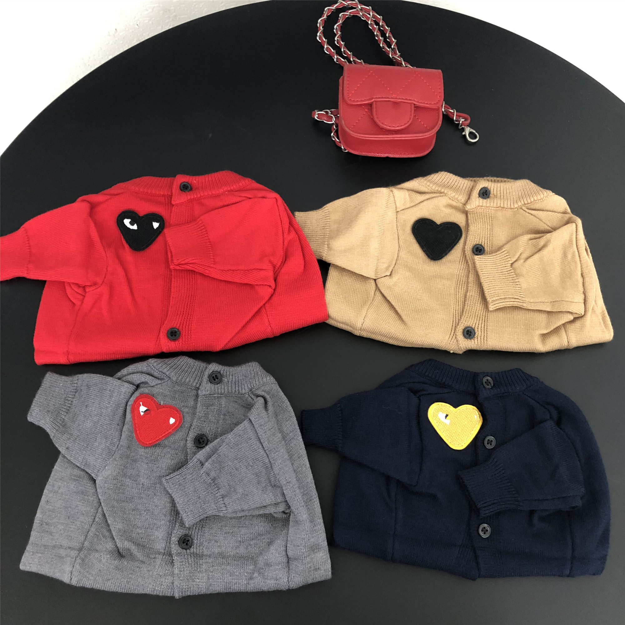 Chic Animal Fashions Collection: Stylish Coat Designs with Love Labels Available for Canine Companions