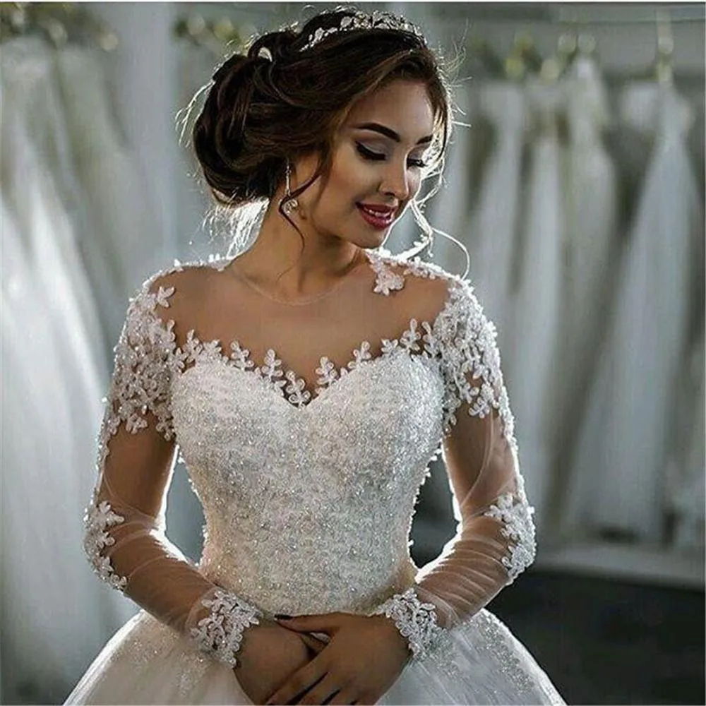 2024 Princess Long Sleeves Ball Gown Wedding Dresses Lace Appliques Beaded Arabic Dubai Ivory Tulle Bridal Gowns Back Buttons Chapel Train Robe De Mar