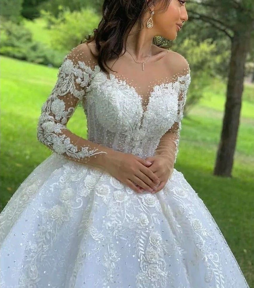 2024 A Line Wedding Dresses Jewel Neck Long Sleeves Lace Appliques Crystal Beads Illusion 3D Floral Flowers Sequins Sweep Train Sexy Bridal Gowns 0513