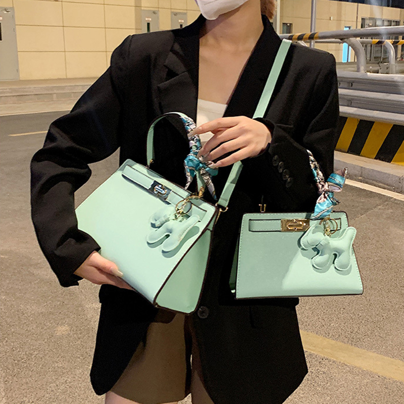 New Senior Luxury Women's Handbag High End Brand Leather Designer Shoulder Bag Lady With Cute Pendant Orange Color Crossbody Bag