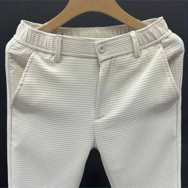 Leisure Trend Korean Edition Summer Solid Color Zipper Pocket Mens High Waist Elastic Slim Fit Straight Nine Split Pants 240806
