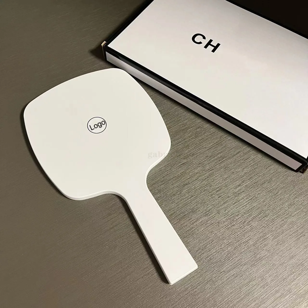 2024 new Designer holding makeup mirror black and white classic logo mirror women's travel portable small essential makeup mirror in bag