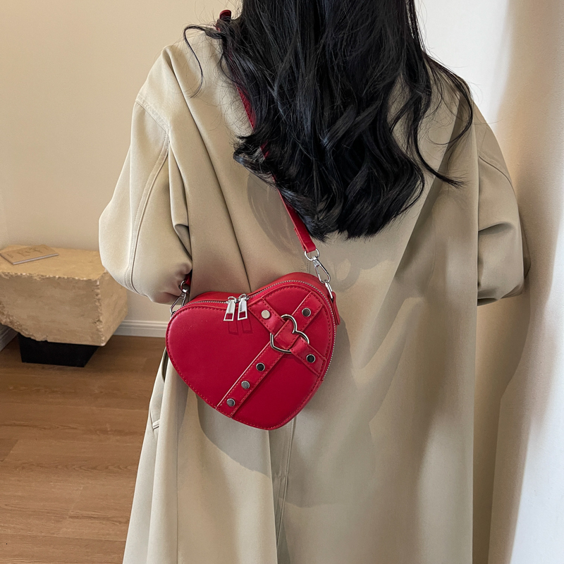 Fashion Designer Original Mini Handbag With Heart shaped Shape High quality And Multifunctional Compact Women s Rivet Shoulder Bag 2025 New Women s Wa