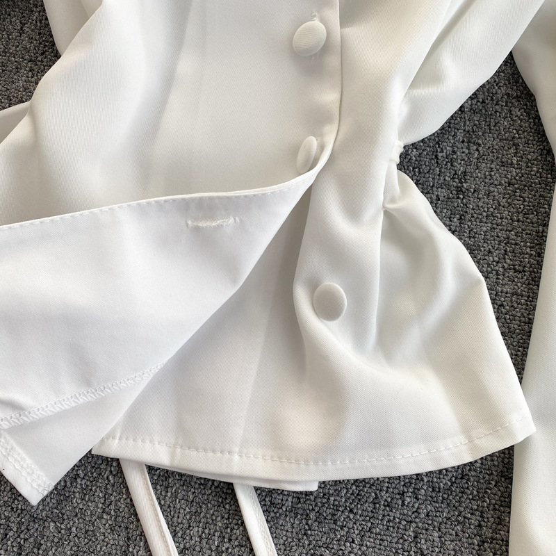 Blouse design sense niche diagonal open breasted buckle tied waist slimming irregular bubble sleeve top for women