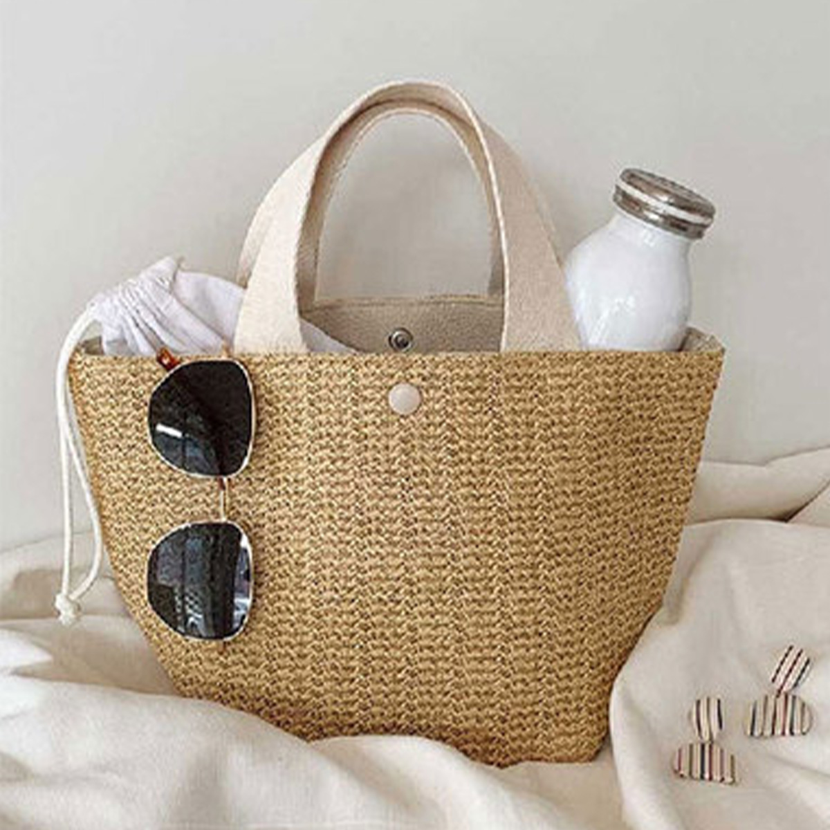 The tote bag new rural style woven bag retro casual hand-held grass woven bag summer beach vacation women's bag