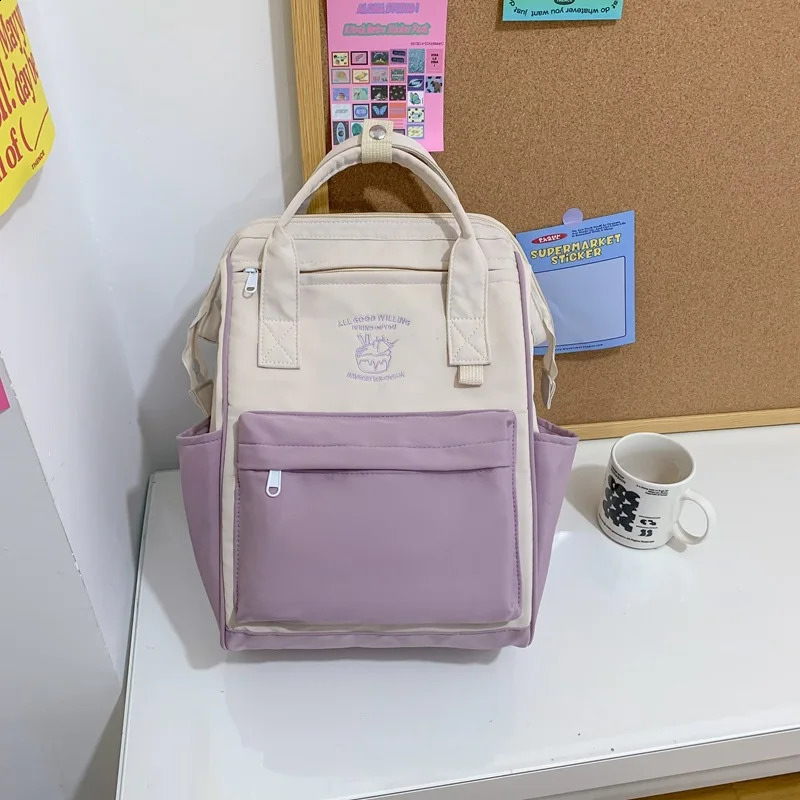 Korean nylon waterproof mens and womens backpacks large capacity travel laptop elementary school handbags 240813
