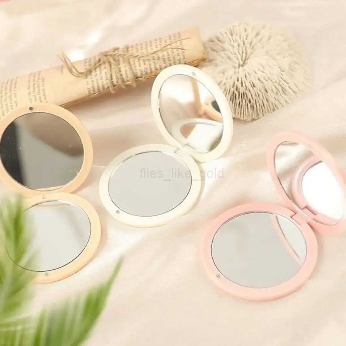 Wholesale of high-end circular folding small mirrors portable pockets flip mirrors mini double-sided makeup handheld mirrors W240813