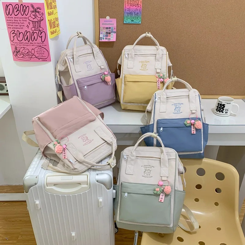 Korean nylon waterproof mens and womens backpacks large capacity travel laptop elementary school handbags 240813