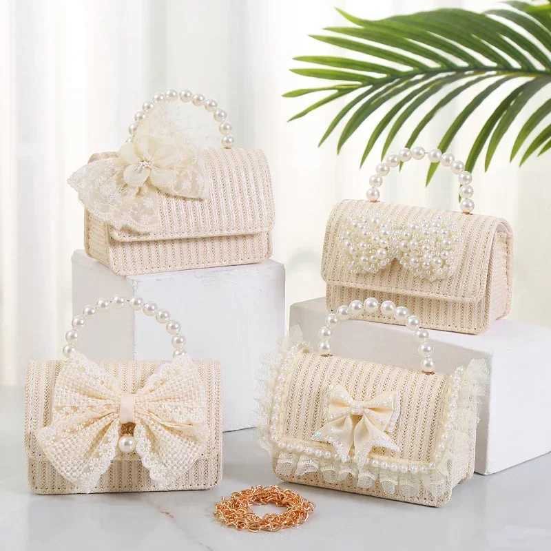 Cute lace bow flower childrens grass shoulder bag simple pearl mini handbag fashionable princess coin wallet womens messenger bag W240813