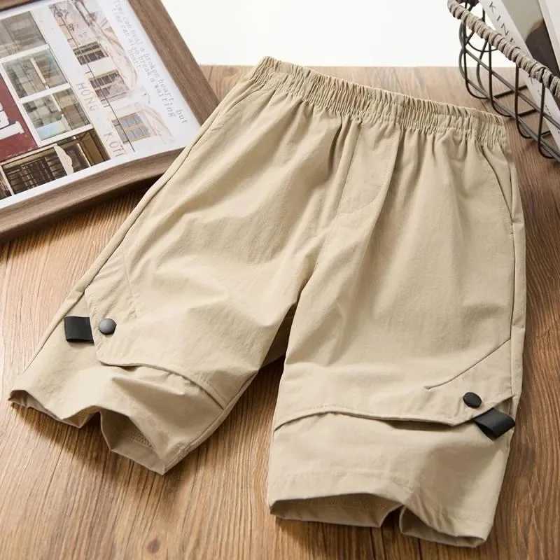 Boys shorts childrens solid color Trouser with button teenagers pocket shorts 2024 summer casual clothing for children aged 3 to 12 W240813