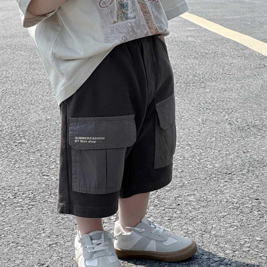 Boys summer tight fitting Korean version childrens large pocket shorts boys treasure pants street trend childrens summer clothing W240813