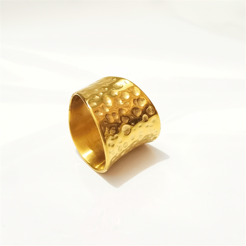 Designer ring stainless steel embossed hollow ins niche cold wind notch irregular wide face female ring surface plating 18K real gold