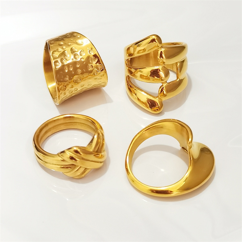 Designer ring stainless steel embossed hollow ins niche cold wind notch irregular wide face female ring surface plating 18K real gold
