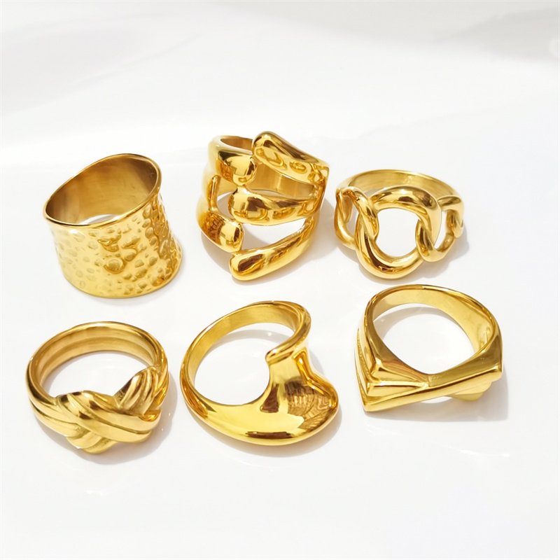 Designer ring stainless steel embossed hollow ins niche cold wind notch irregular wide face female ring surface plating 18K real gold