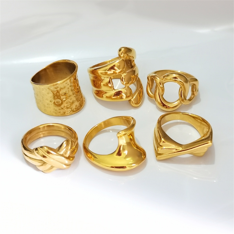 Designer ring stainless steel embossed hollow ins niche cold wind notch irregular wide face female ring surface plating 18K real gold