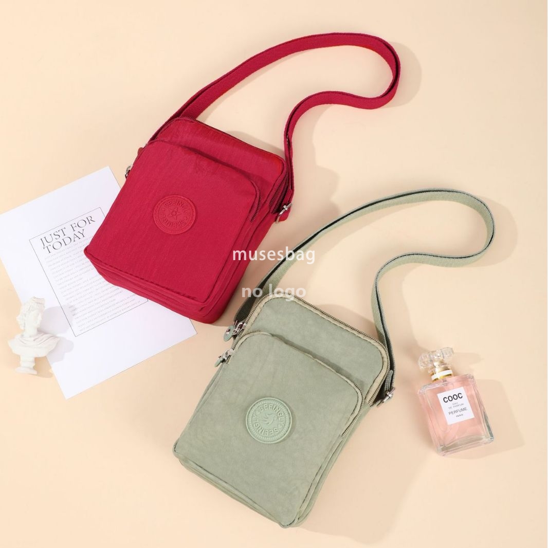 Foreign trade vertical simple bag female Korean version simple zipper single shoulder crossbody vertical version nylon mobile phone bag wholesale