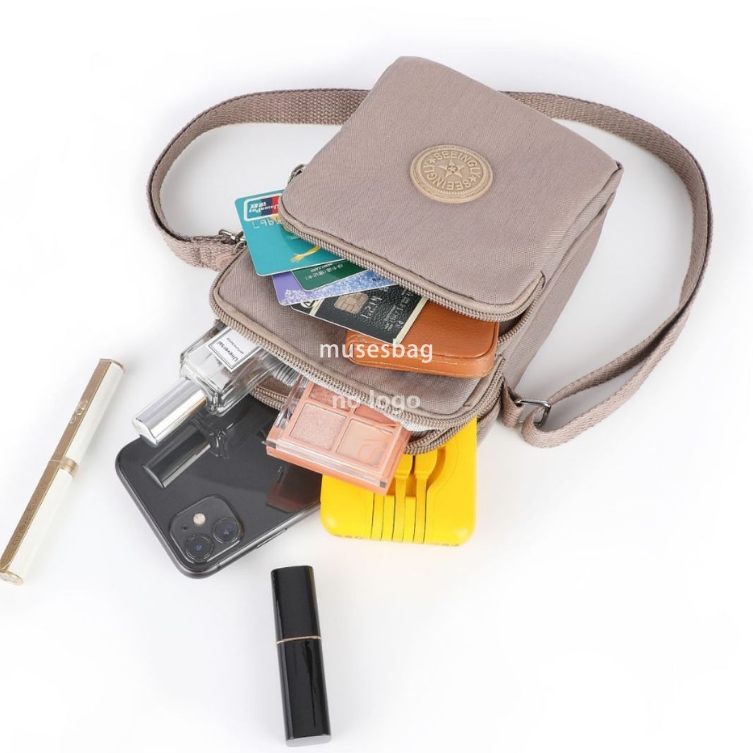 Foreign trade vertical simple bag female Korean version simple zipper single shoulder crossbody vertical version nylon mobile phone bag wholesale