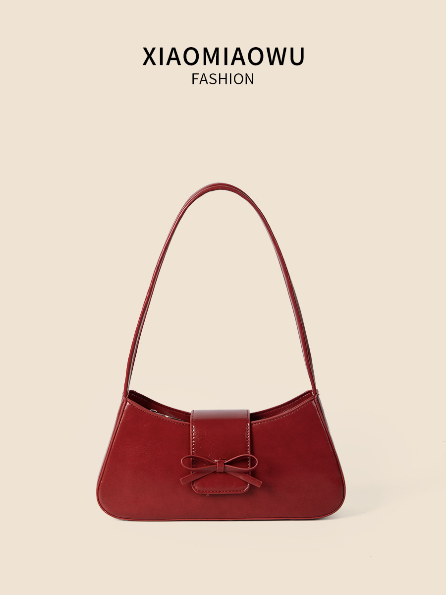 Spring and summer new women's high-end fashion commuting handbag bow spicy girl niche silver armpit bag