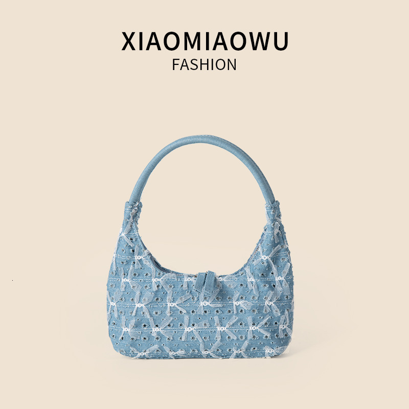 Trendy and personalized denim handbag, women's high-end single shoulder underarm bag, lace bow, broken hole crescent bag