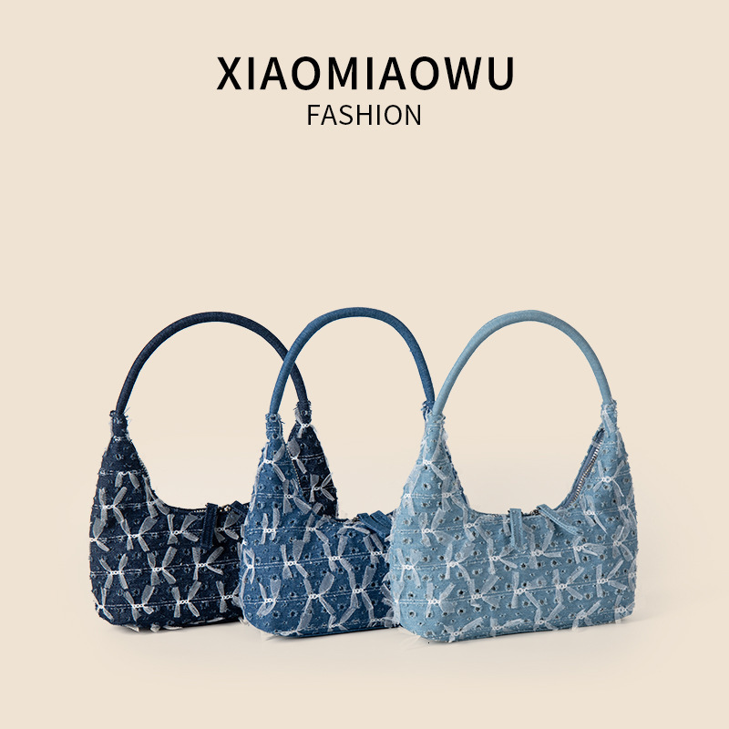 Trendy and personalized denim handbag, women's high-end single shoulder underarm bag, lace bow, broken hole crescent bag