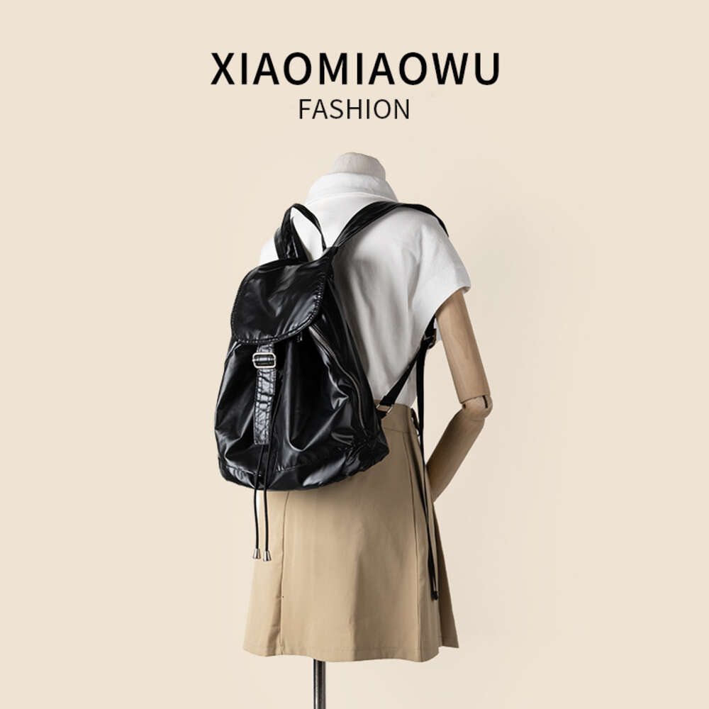 Korean version shiny silver drawstring high-end feel, light travel large capacity backpack, university women's minimalist