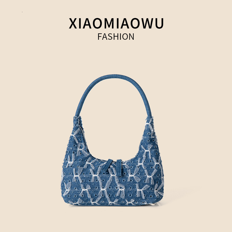 Trendy and personalized denim handbag, women's high-end single shoulder underarm bag, lace bow, broken hole crescent bag