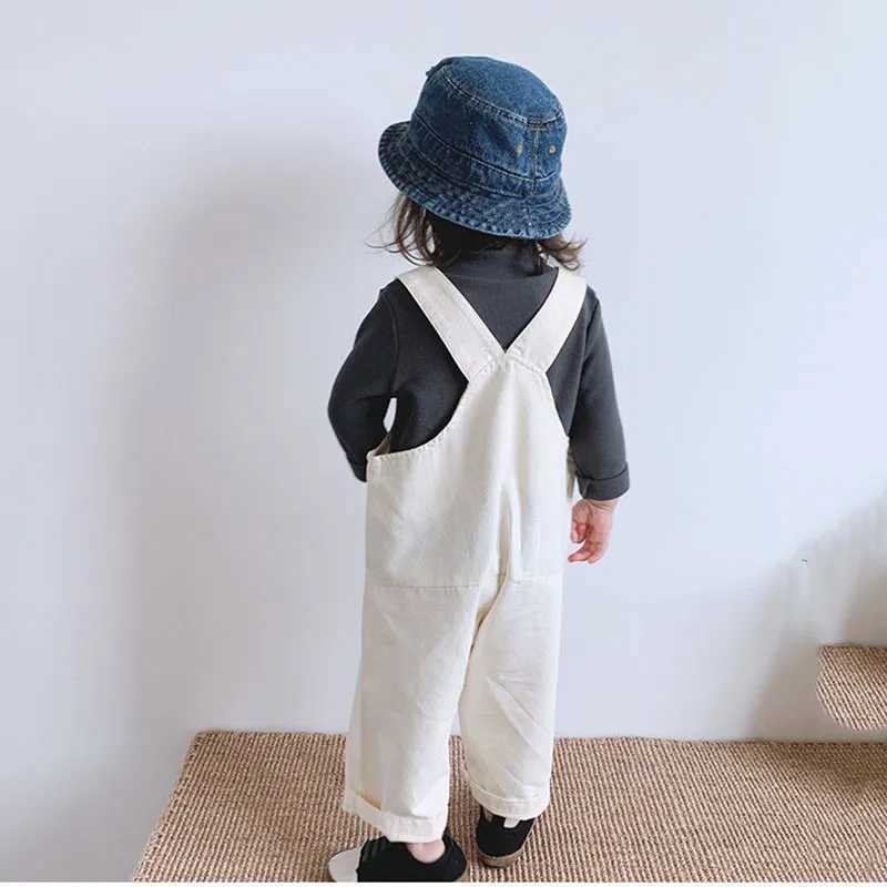 Autumn childrens pocket denim covering boys solid simple suspension jumpsuit girls baby loose casual pants baby cotton Trouser W240806