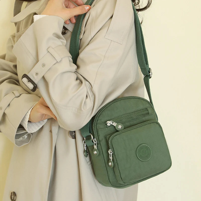 Womens Mini Shoulder Bag 2024 Waterproof Nylon Stand up Mobile Wallet Multi layer Messenger Bag Womens Mini Cross Bag 240819