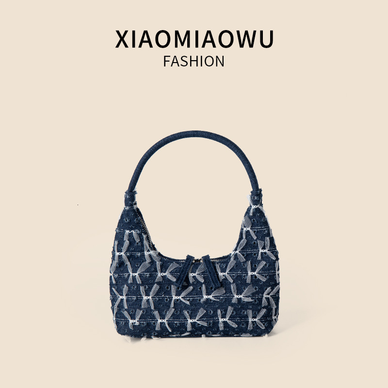 Trendy and personalized denim handbag, women's high-end single shoulder underarm bag, lace bow, broken hole crescent bag