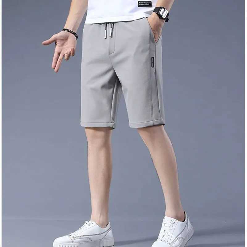 High Quality Polyester Ice Silk Shorts Men 2024 New Korean Version Of Loose Elastic Splicing Beach Five Minute Medium PantsXJ240817
