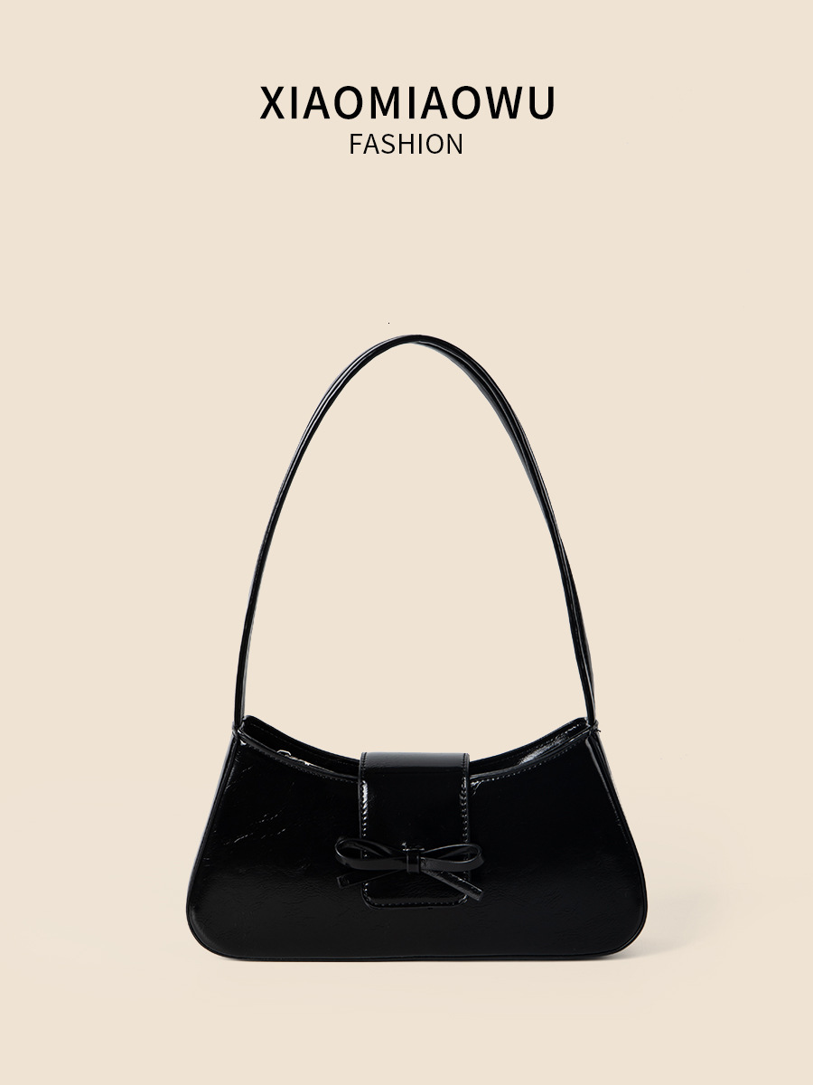 Spring and summer new women's high-end fashion commuting handbag bow spicy girl niche silver armpit bag