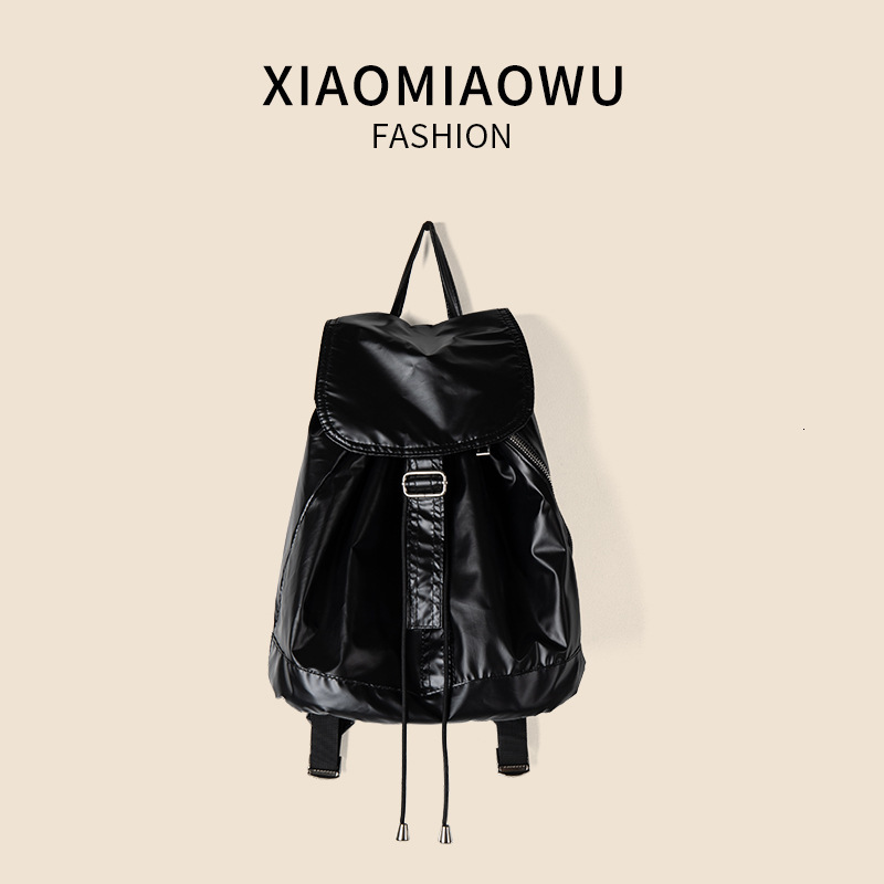Korean version shiny silver drawstring high-end feel, light travel large capacity backpack, university women's minimalist
