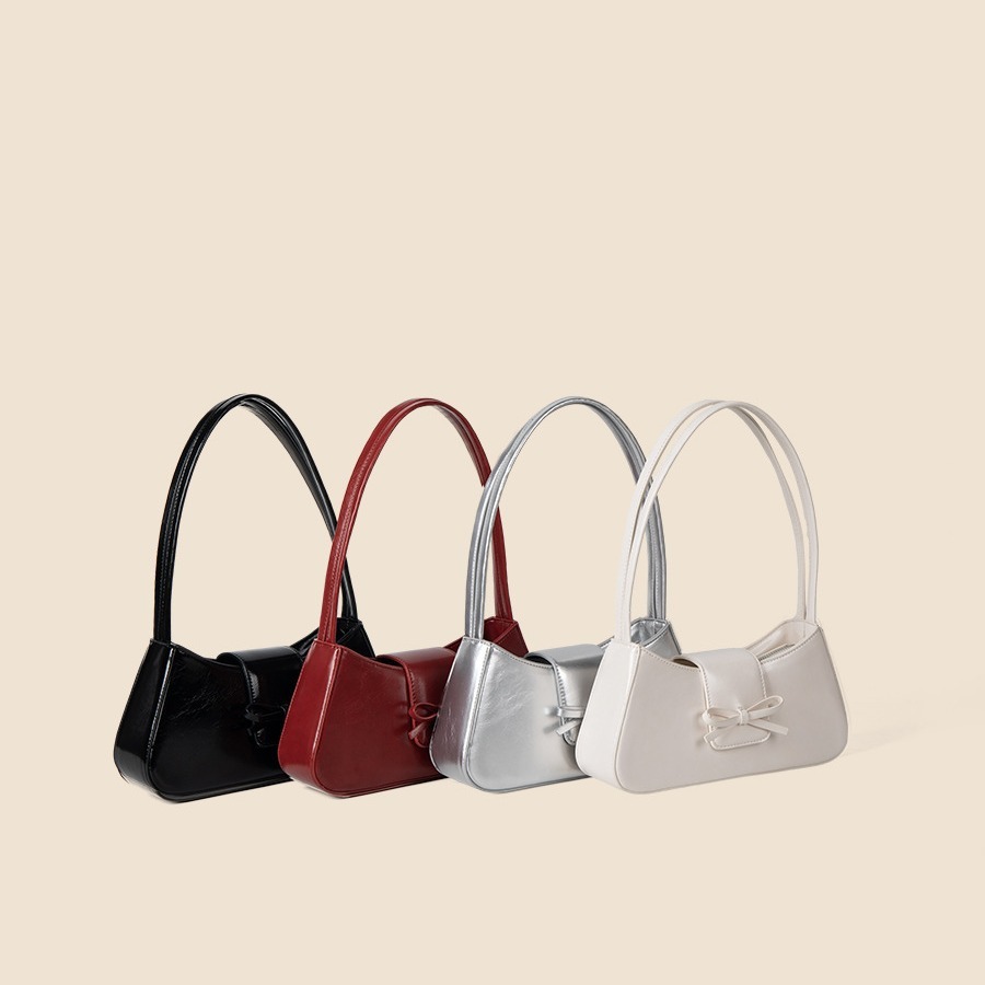 Spring and summer new women's high-end fashion commuting handbag bow spicy girl niche silver armpit bag