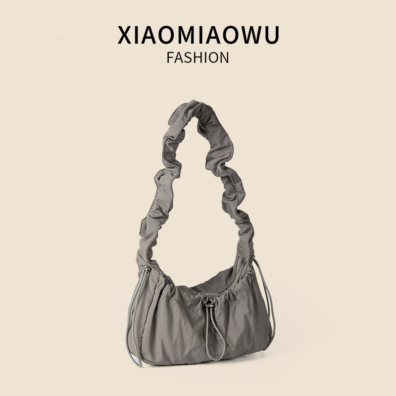Pulling rope nylon pleated bag for women in summer, lightweight solid color women's crossbody bag, fashionable high-end, versatile and single sho