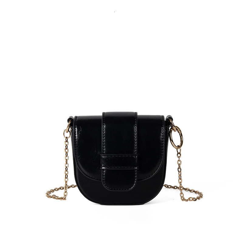 Mini new solid color saddle with niche texture, flip cover magnetic buckle crossbody bag, women's summer chain PU shoulder bag