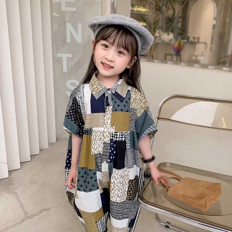 Childrens vacation beach overalls girls Korean summer jumpsuit fashionable and sweet lapel patchwork loose jumpsuit W240806